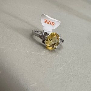 Elegant Silver Ring with Yellow Gemstone